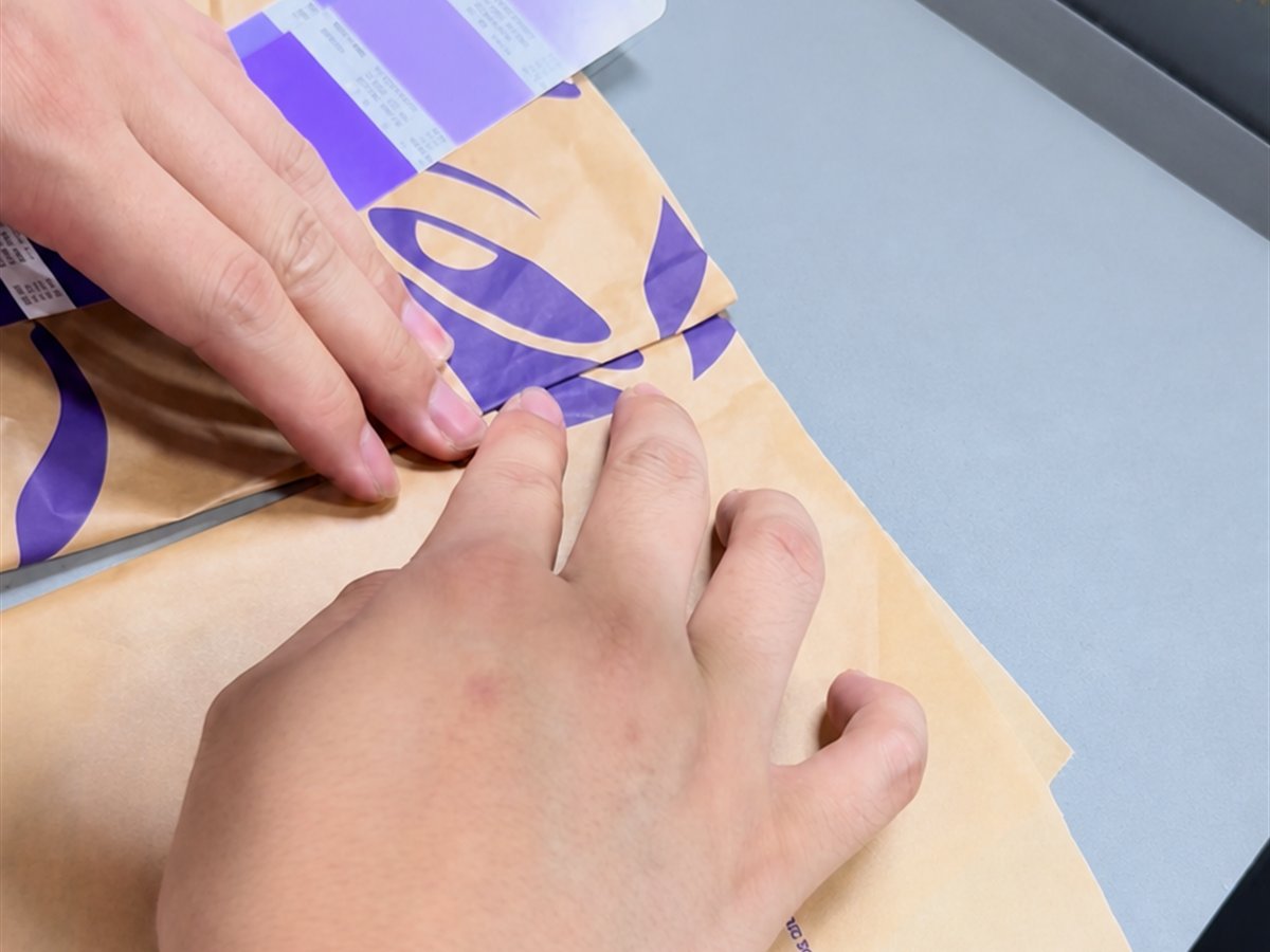 Manual inspection of printed paper against a color reference
