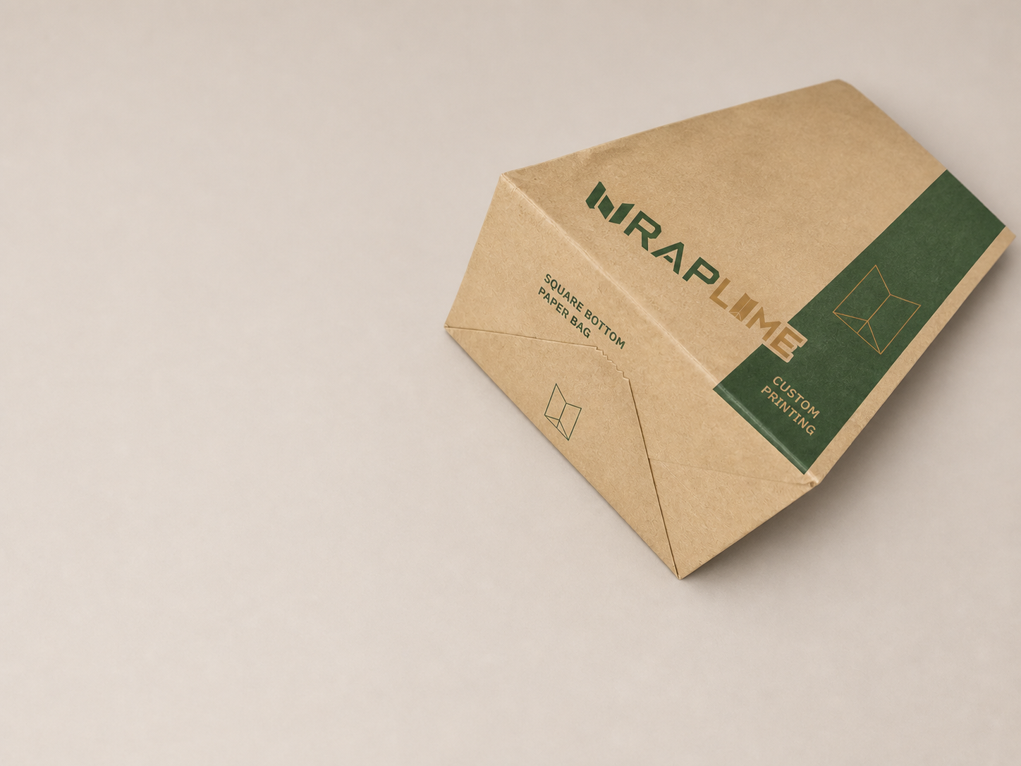 Close-up view of a WRAPLUME square-bottom kraft paper bag showing the folded bottom structure